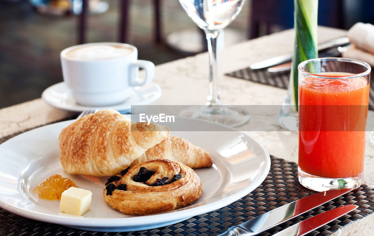 CLOSE-UP OF BREAKFAST SERVED ON TABLE WITH FOOD