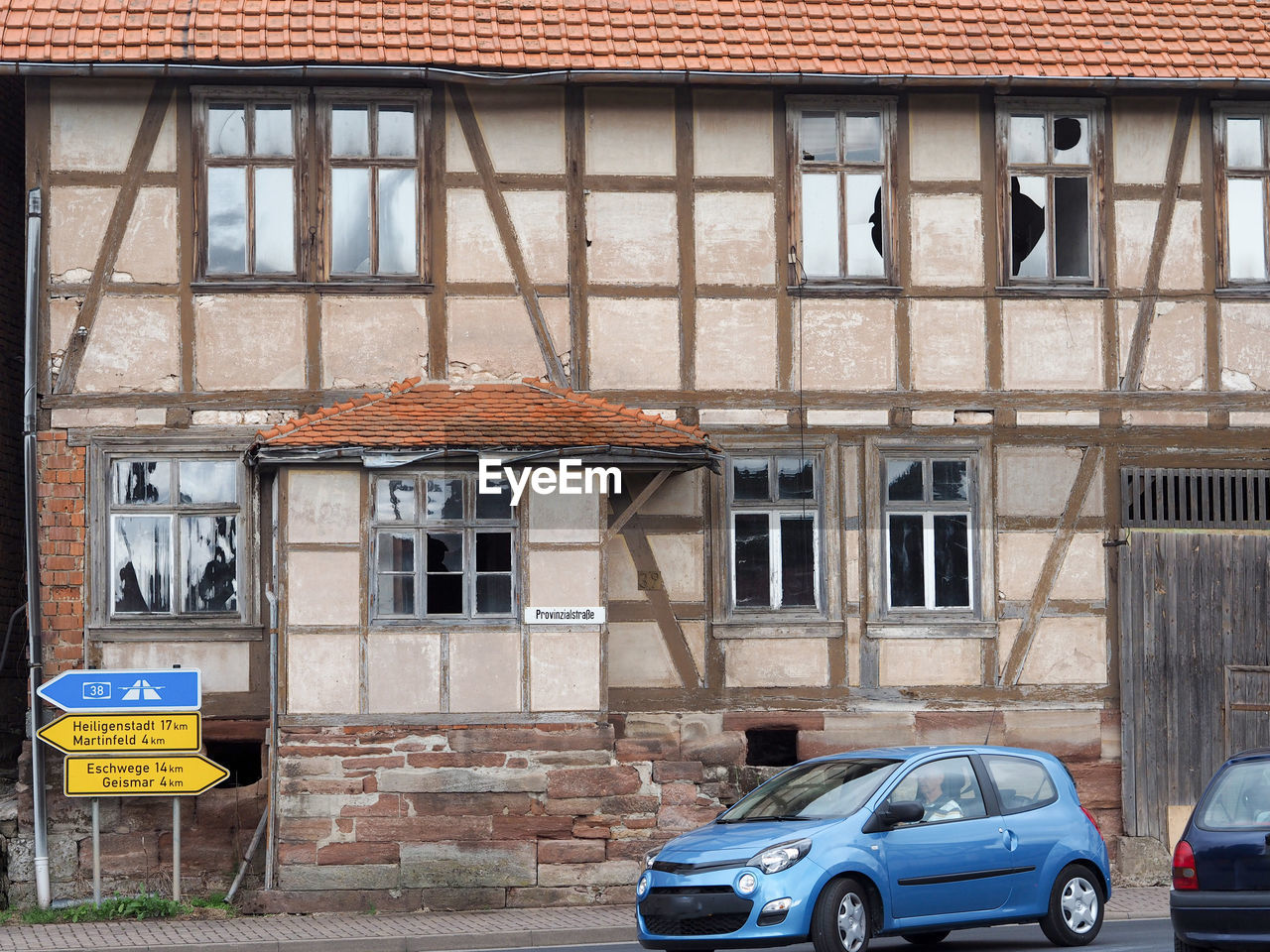 CARS PARKED BY OLD BUILDING