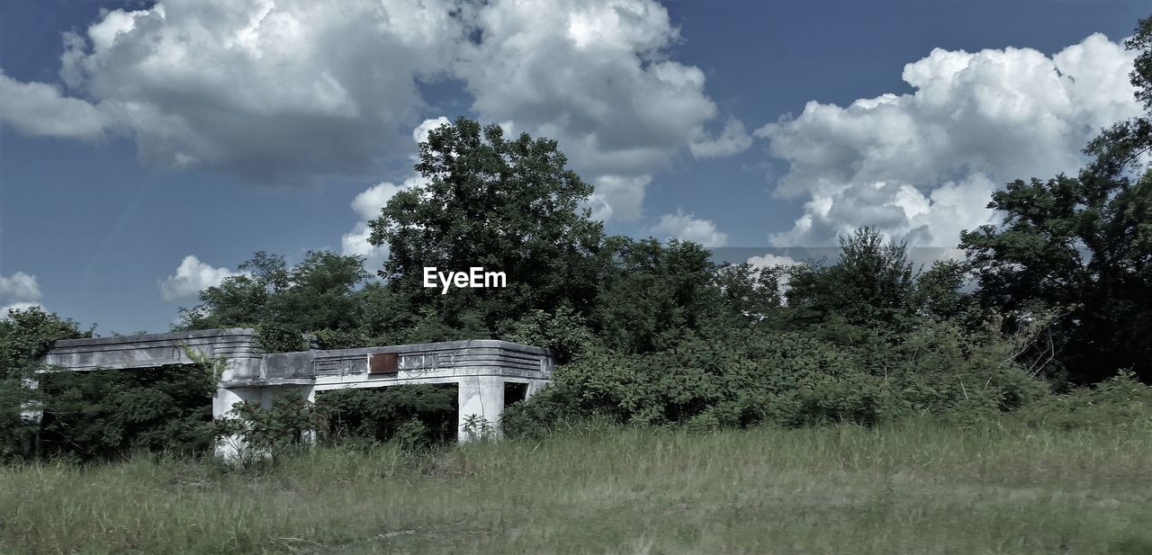 BUILT STRUCTURE ON FIELD AGAINST SKY