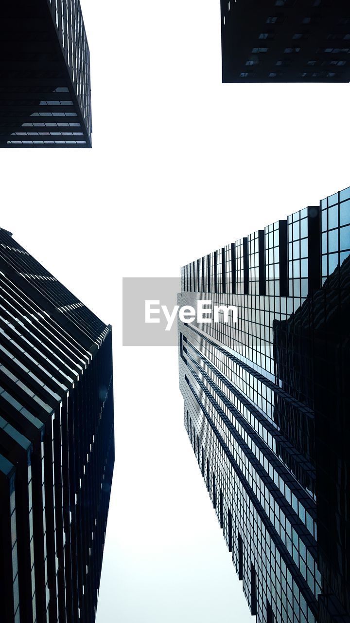 Directly below shot of modern buildings against sky