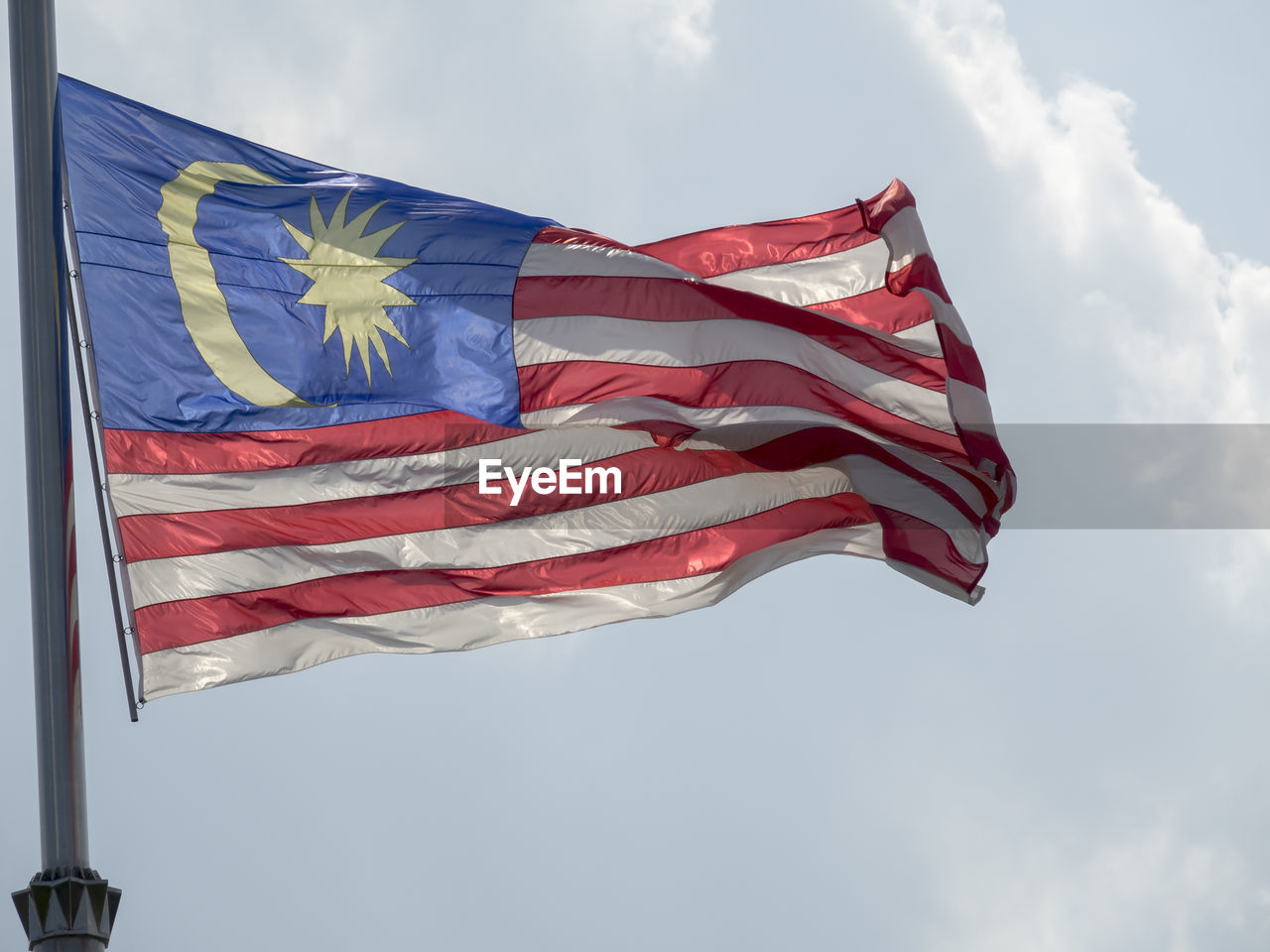 Low angle view of malaysia flag against sky