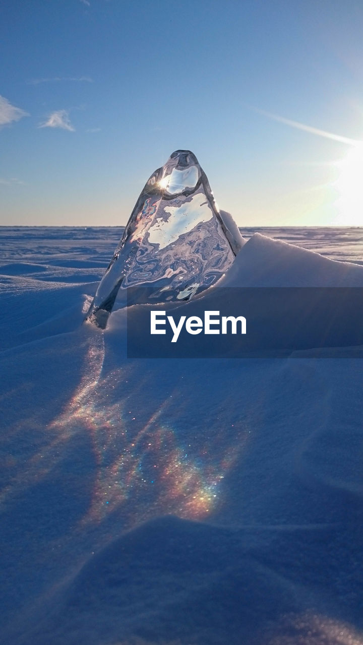 Close-up of ice against sky