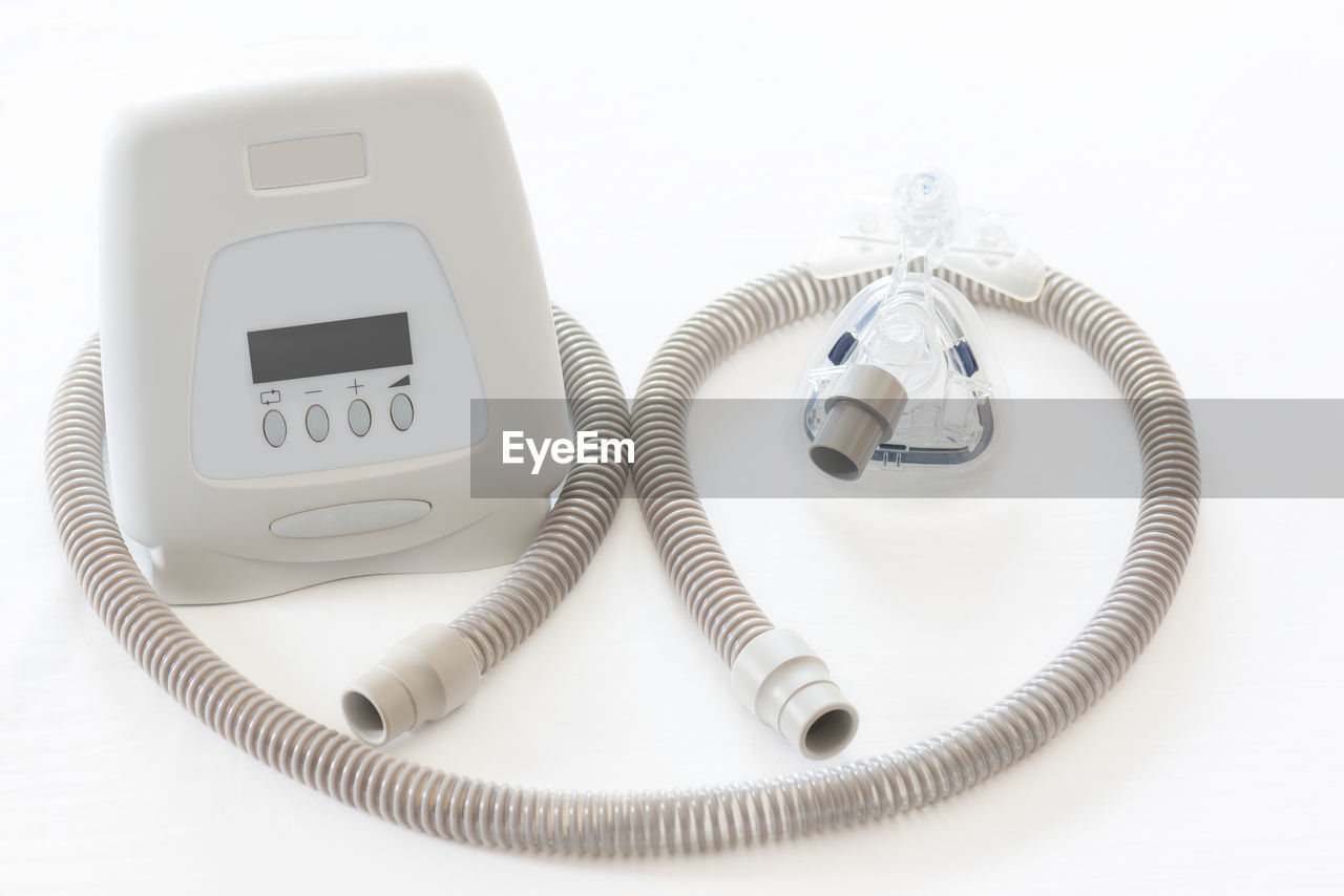 Close-up of cpap machine over white background