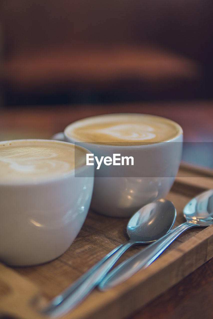 CLOSE-UP OF COFFEE ON TABLE AT HOME