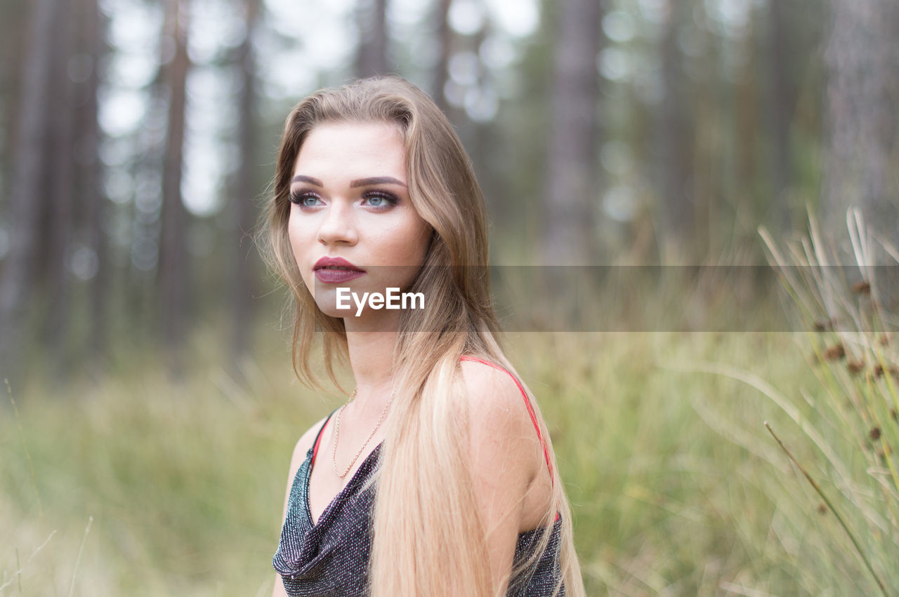 Woman with long hair looking away