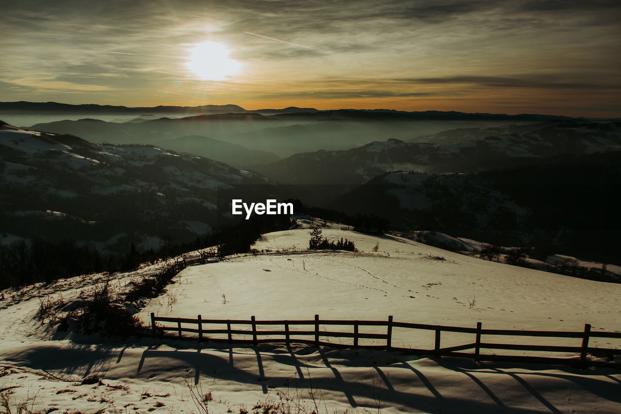 SCENIC VIEW OF SNOW COVERED LANDSCAPE