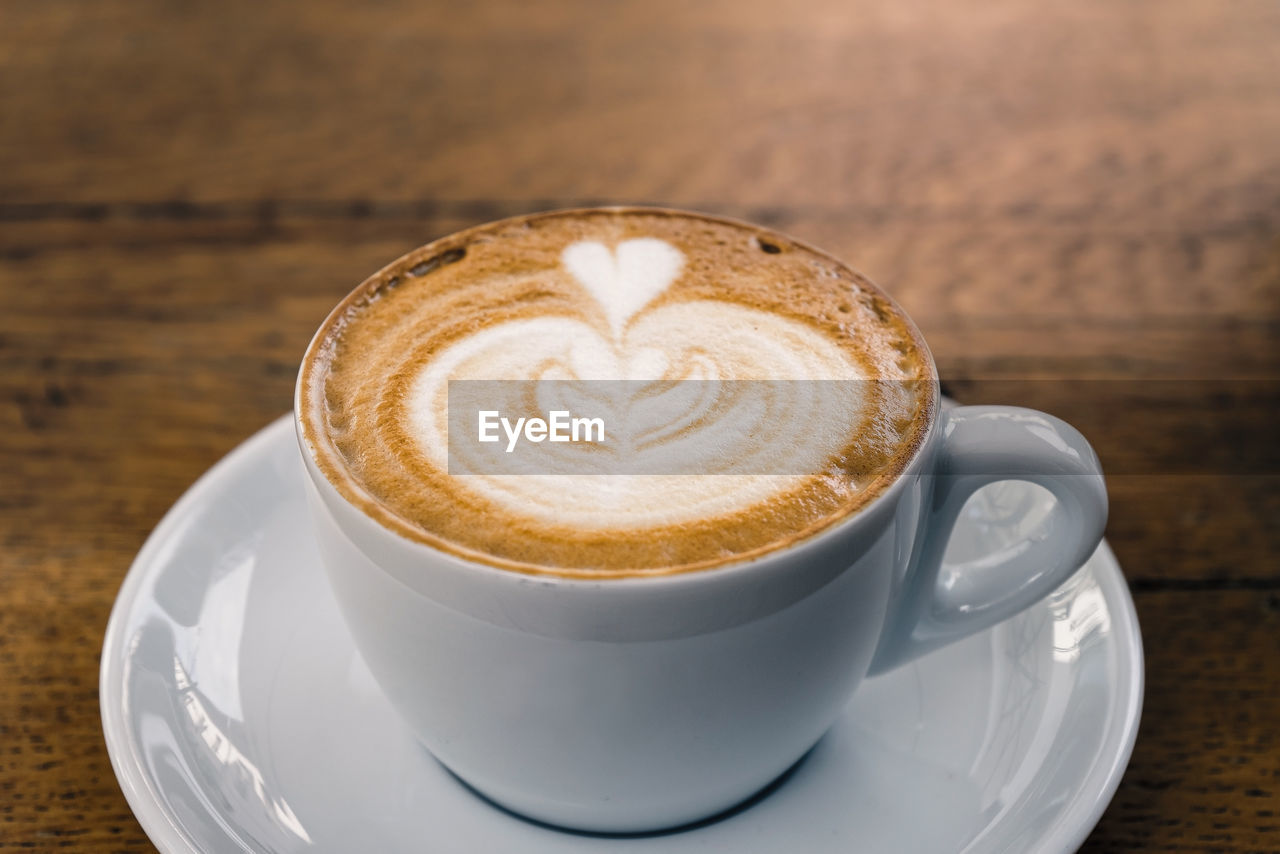 Close-up of cappuccino on table.