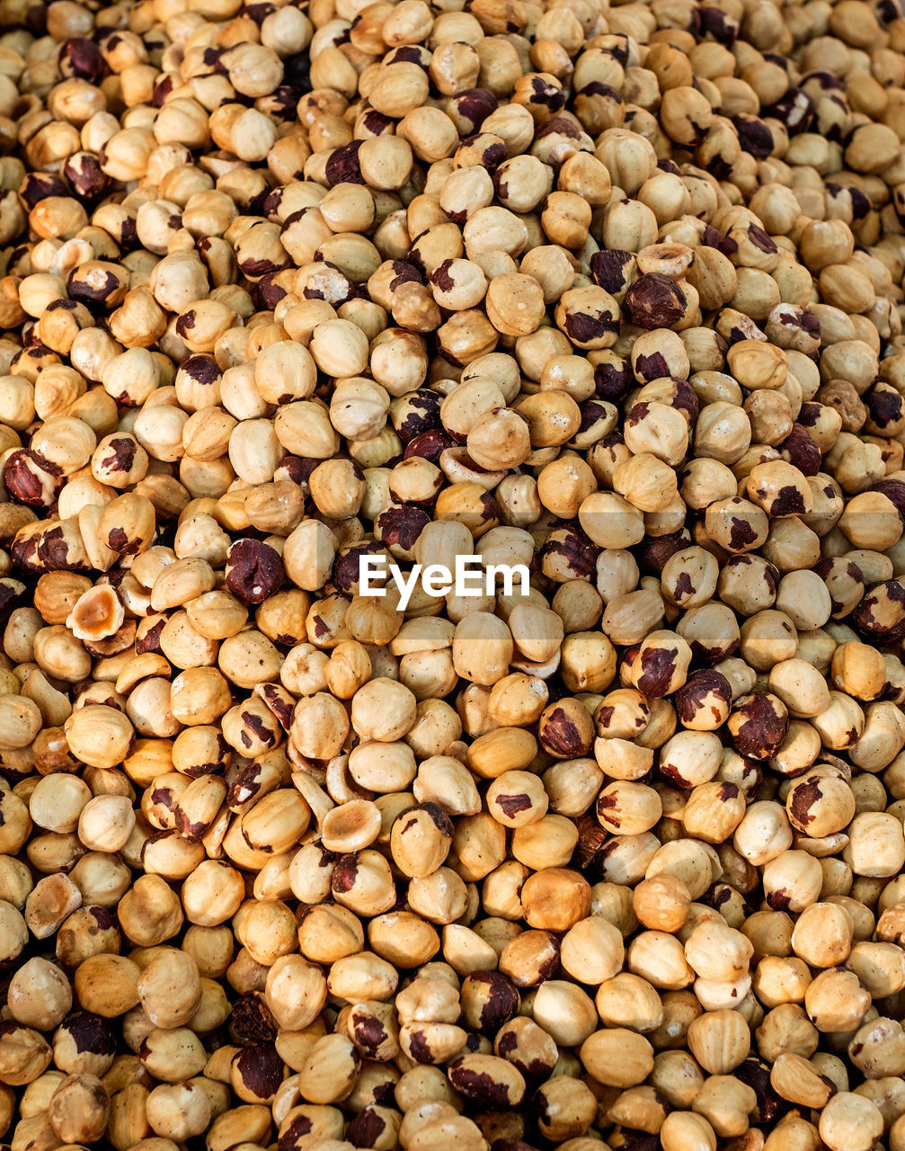 Dried and roasted hazelnuts background