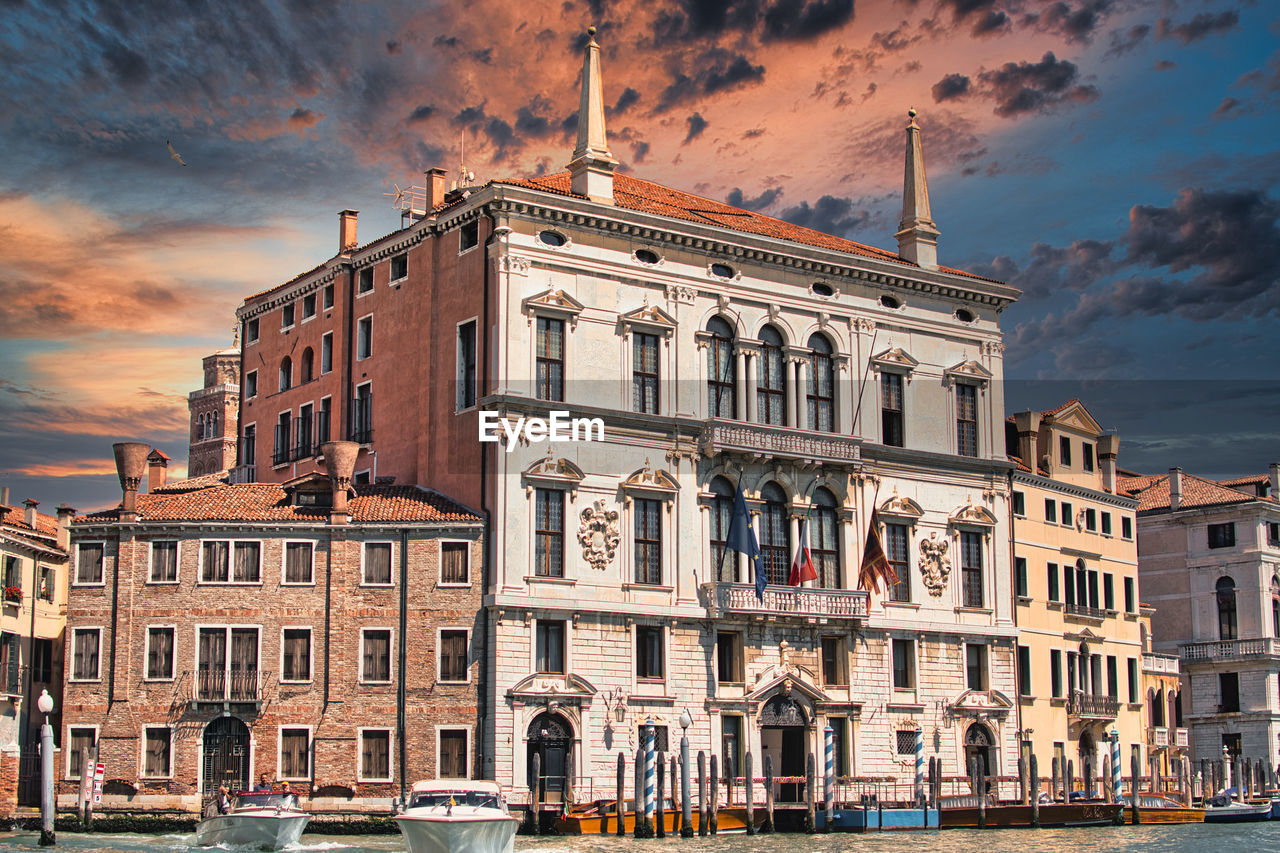 Seat of the municipality at sunset with the grand canal empty during the covid period in venice