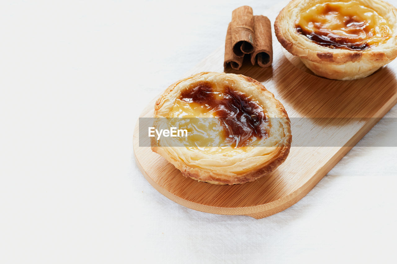 Pasteis de nata typical portuguese dessert. white background and selective focus. pastry concept