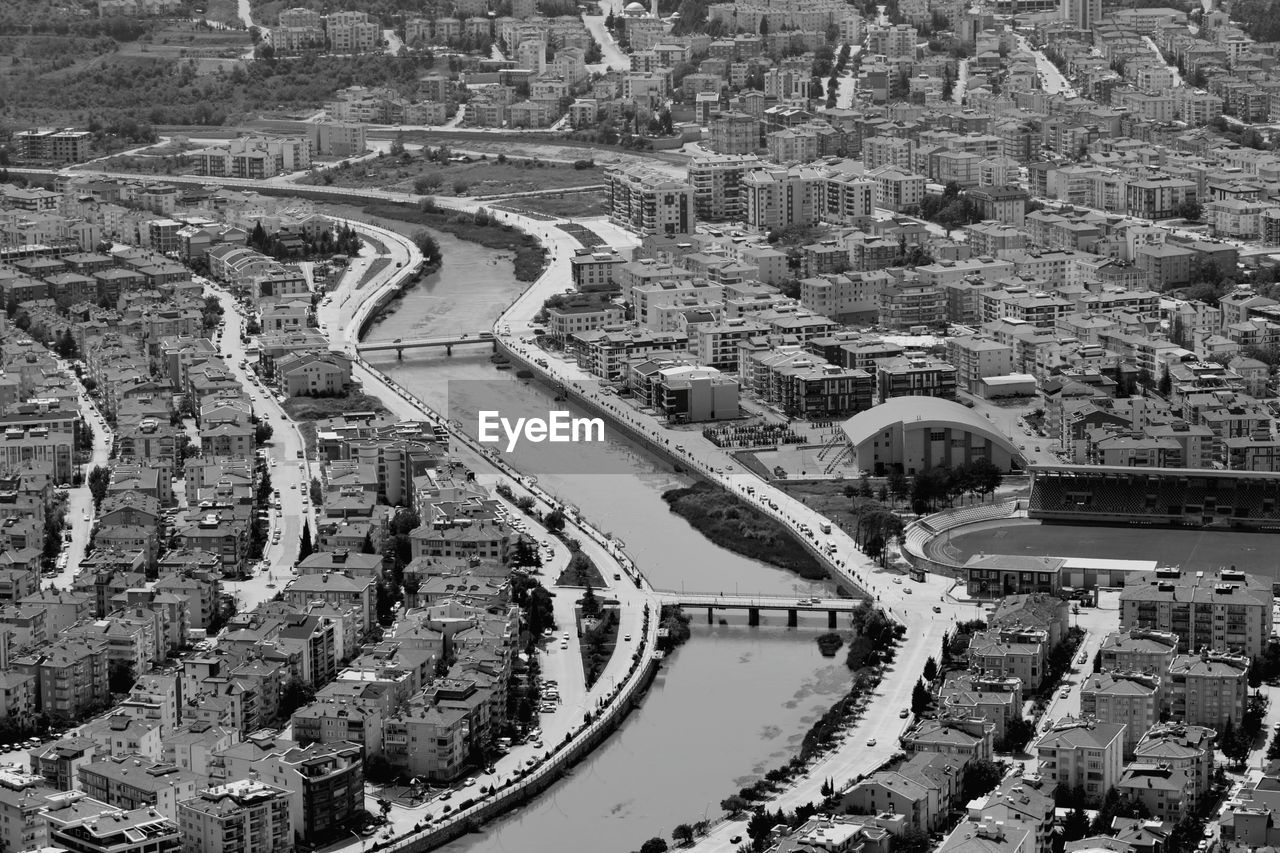 HIGH ANGLE VIEW OF CITY STREET BY BUILDINGS