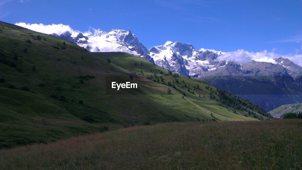 Scenic landscape with snowcapped mountains