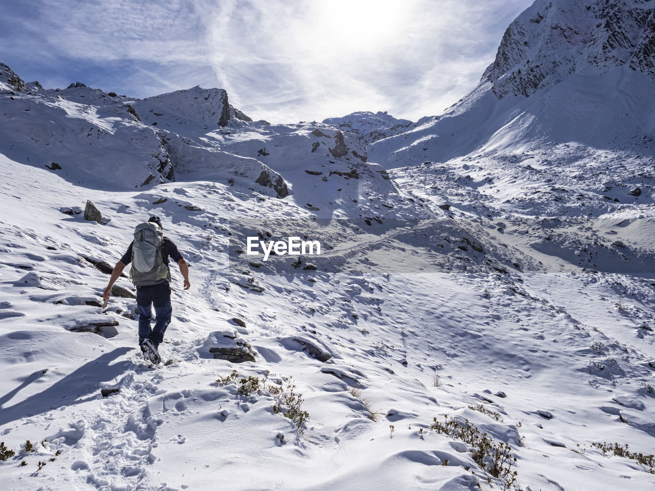 Trekking scene in winter on the italian alps