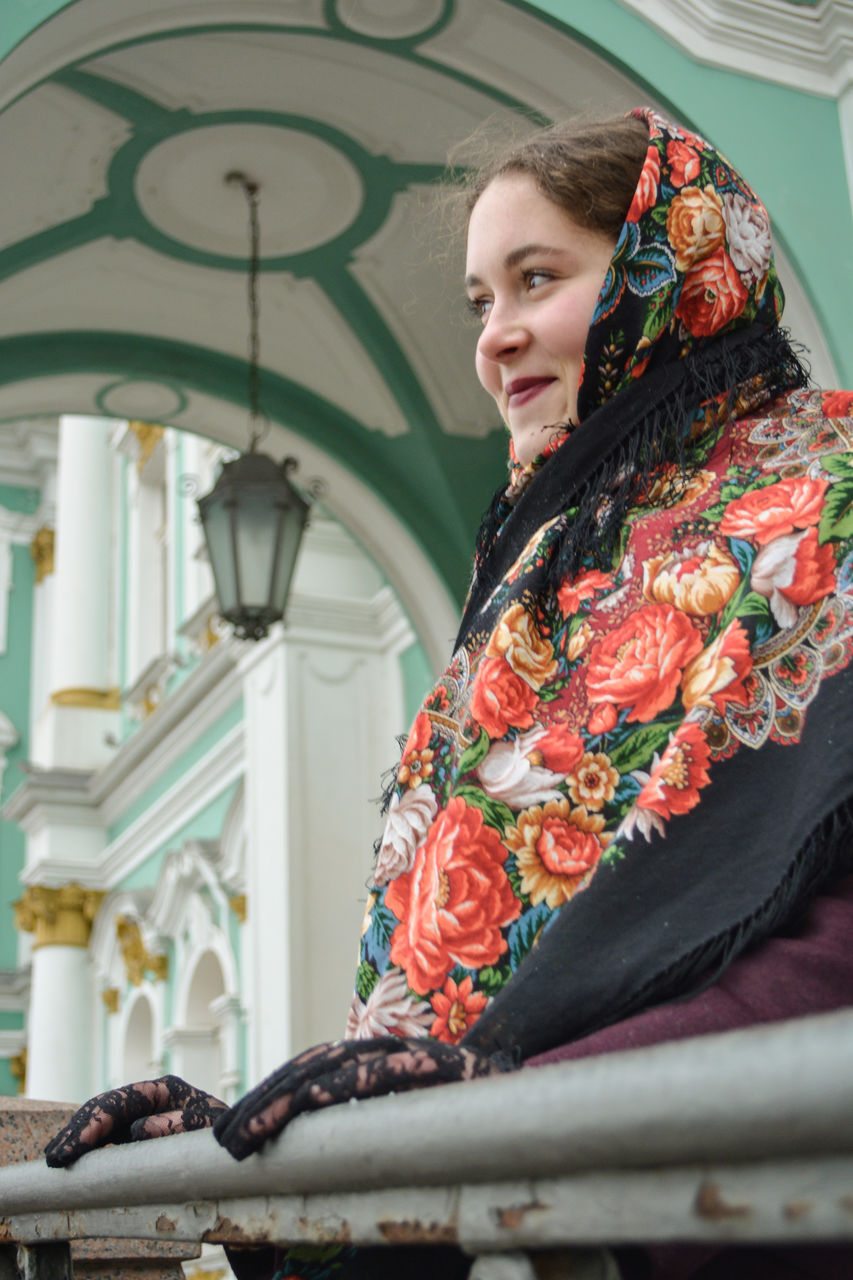 Low angle view of woman looking away