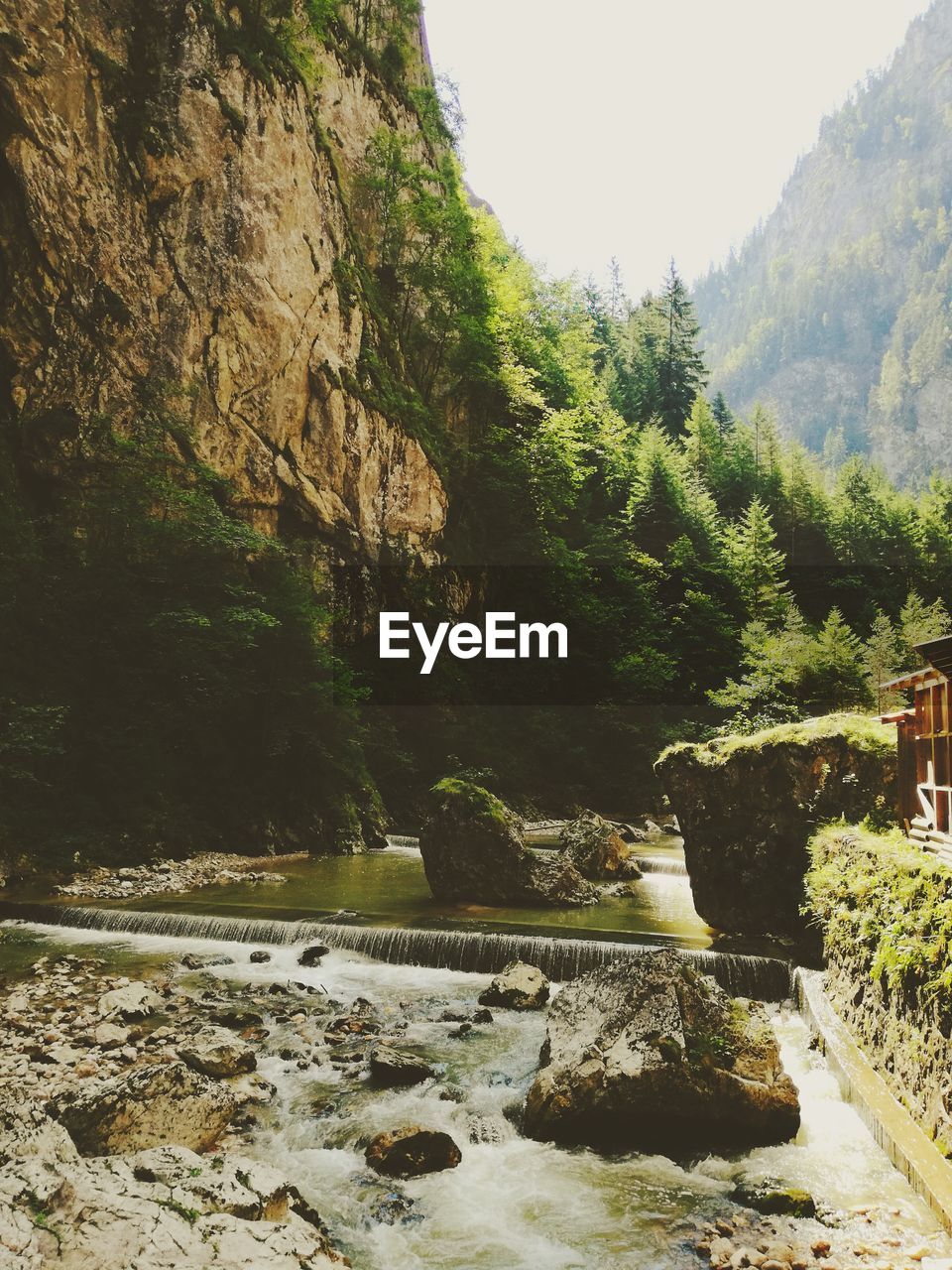 STREAM FLOWING THROUGH ROCKS