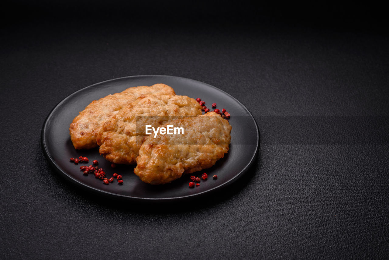 food and drink, food, studio shot, black background, fried food, freshness, indoors, plate, no people, healthy eating, dish, produce, copy space, fast food, meat, wellbeing, fried, meal, fruit, korokke, sweet food, gray, still life