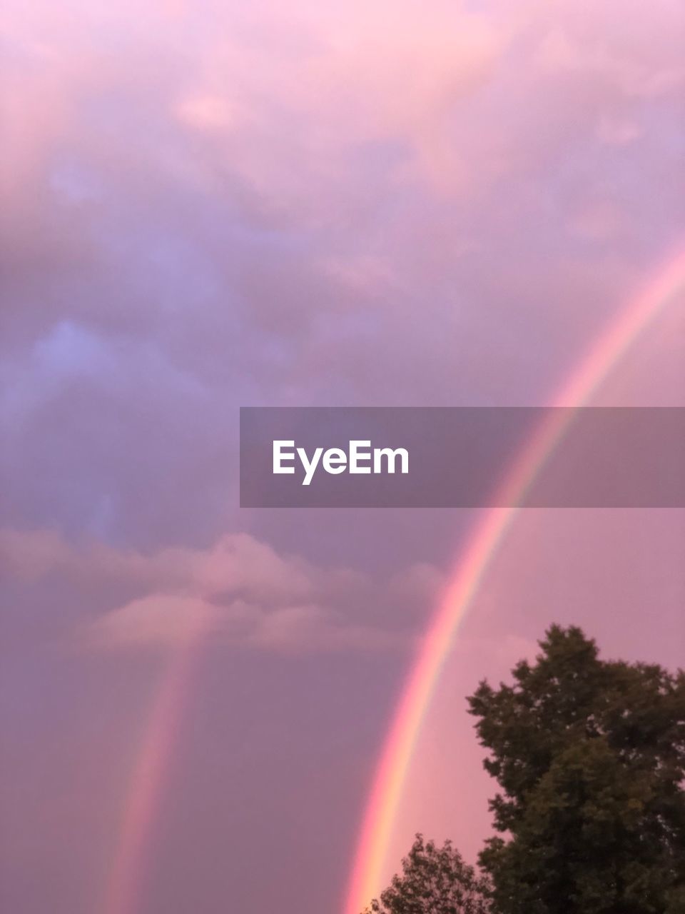 LOW ANGLE VIEW OF RAINBOW AGAINST SKY