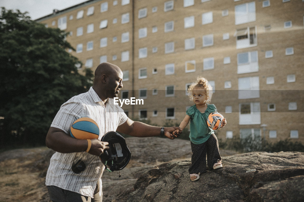 Father and daughter spending time actively outdoors