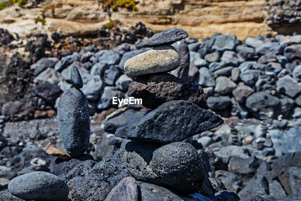 CLOSE-UP OF STONE STACK ON ROCKS