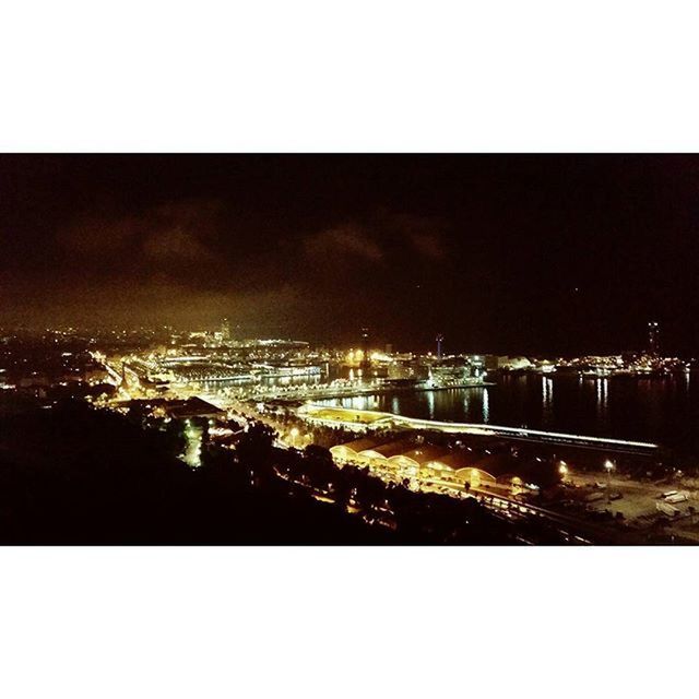 VIEW OF ILLUMINATED CITYSCAPE AT NIGHT