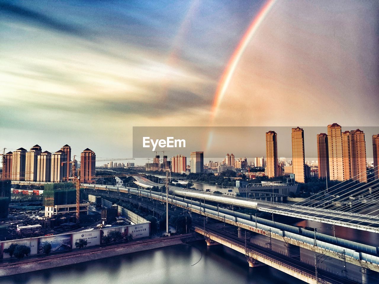 Panoramic view of rainbow over city