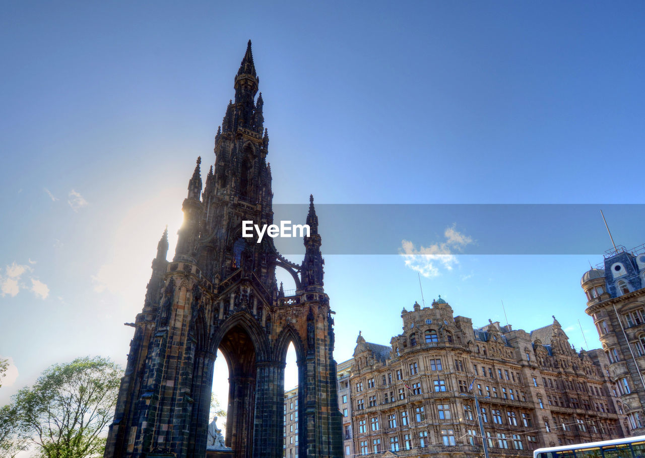 LOW ANGLE VIEW OF CATHEDRAL AGAINST SKY IN CITY