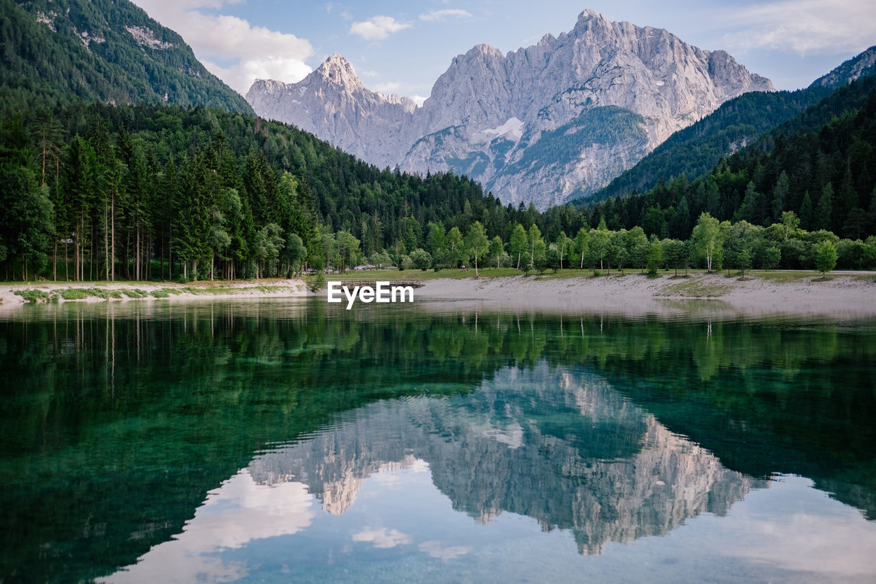 Scenic view of lake and mountains against sky