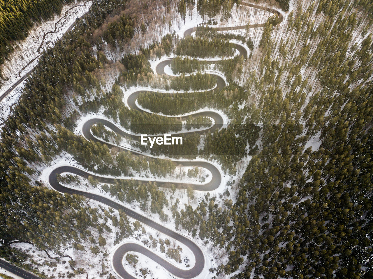 HIGH ANGLE VIEW OF ROAD SIGNS ON SNOW