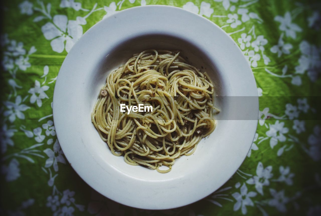 High angle view of noodles served on bed