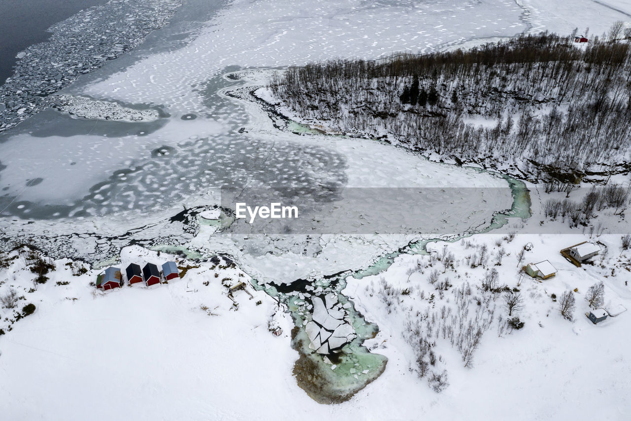 High angle view of frozen lake in town