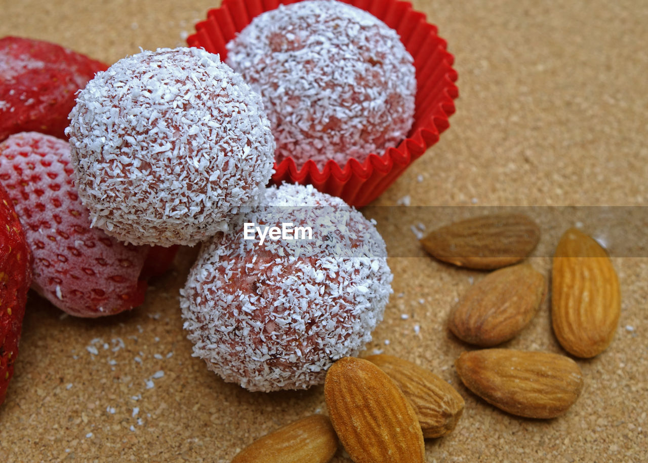 High angle view of energy bites with healthy fats and no sugar on wooden table