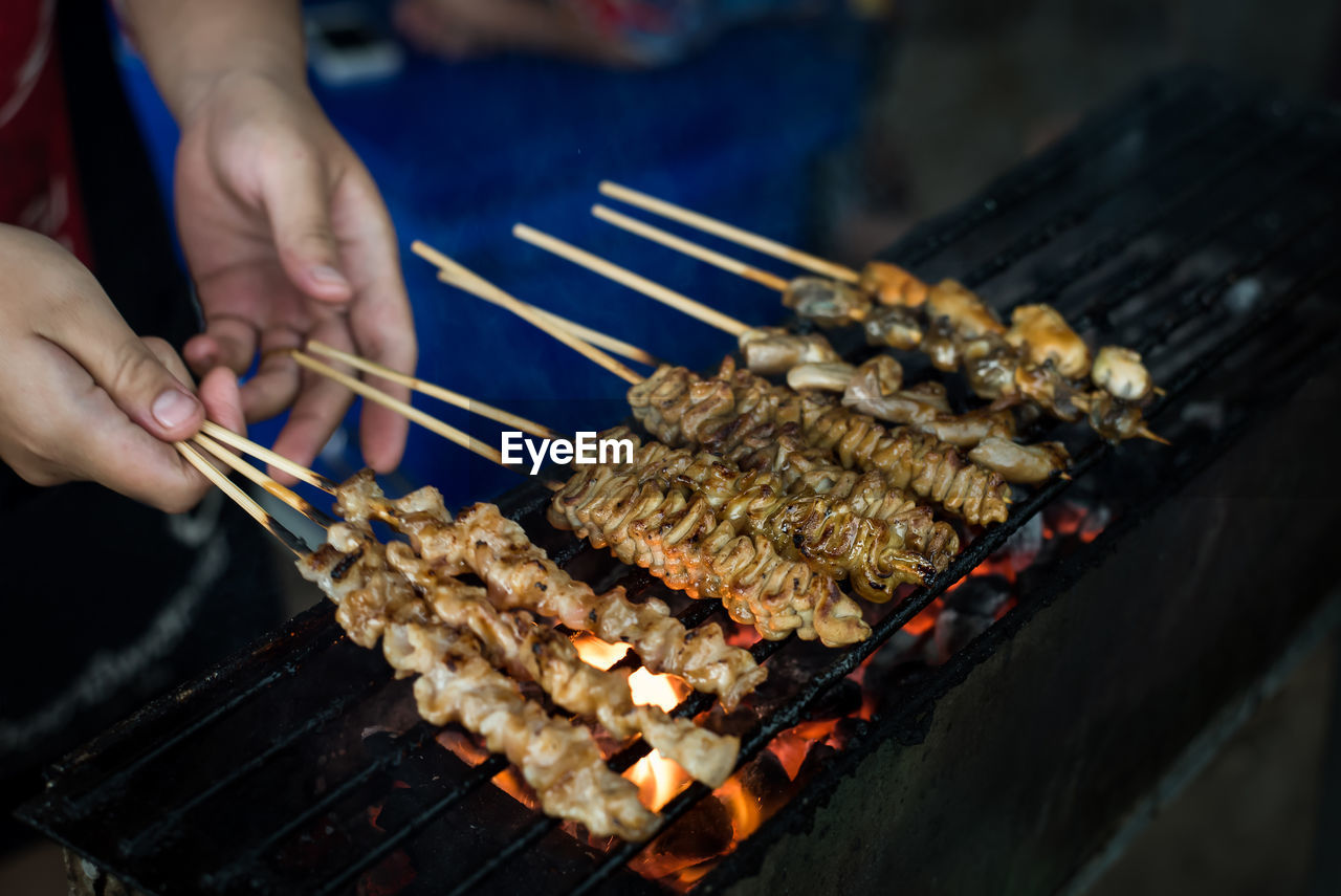 High angle view of preparing food on barbecue grill