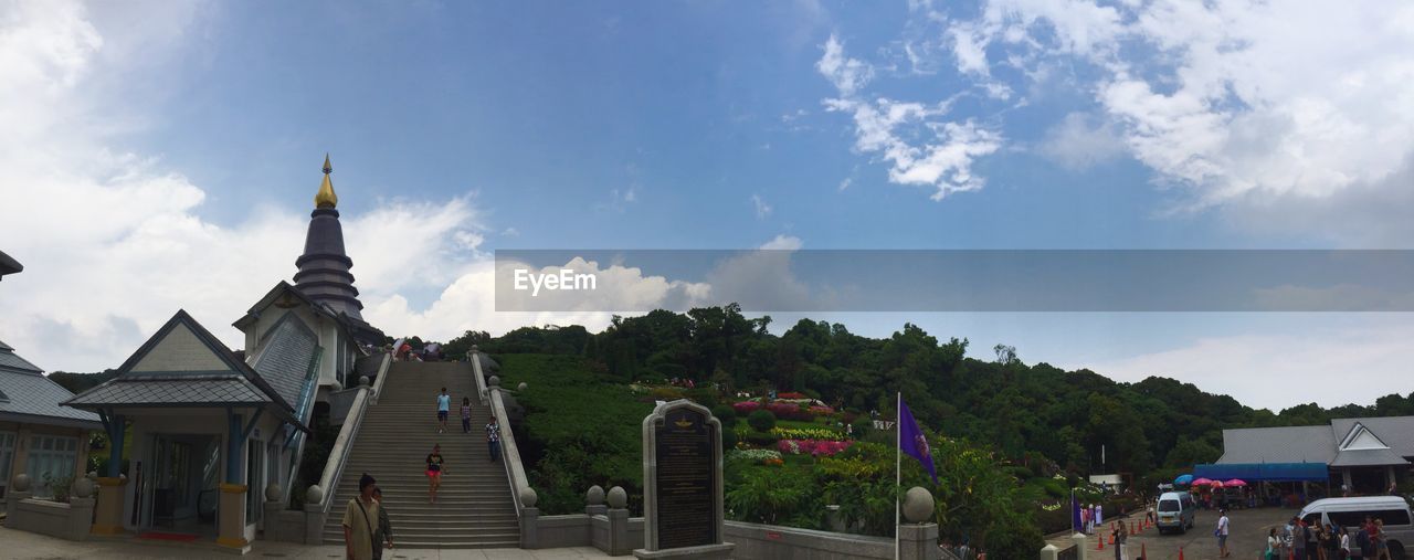 LOW ANGLE VIEW OF TEMPLE AGAINST CLOUDY SKY