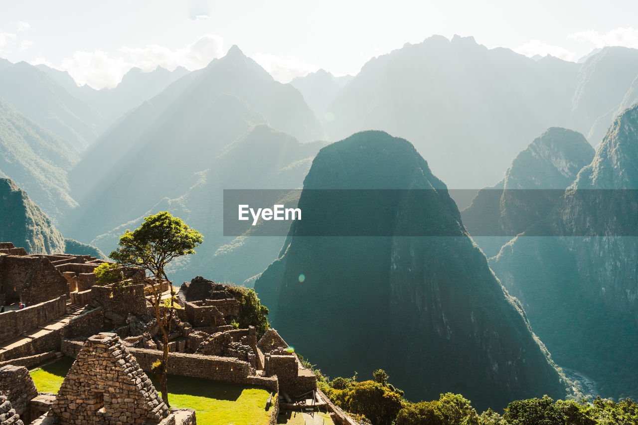 High angle view of townscape and mountains against sky