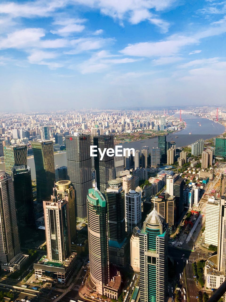 HIGH ANGLE VIEW OF MODERN CITY BUILDINGS AGAINST SKY