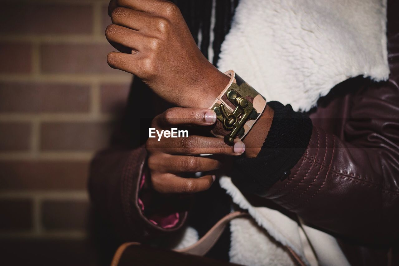 Close-up of man wearing wristband