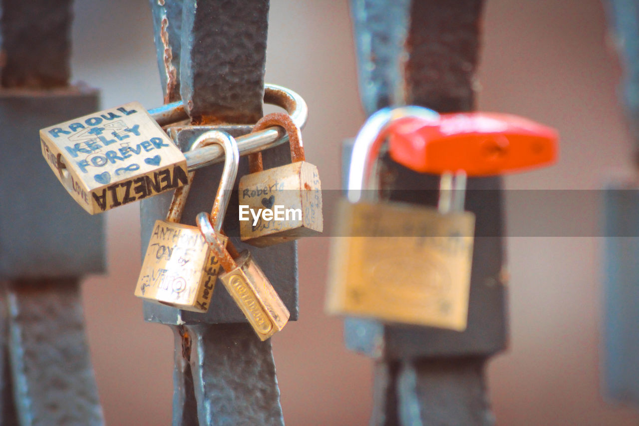 Close-up of padlocks hanging on metal