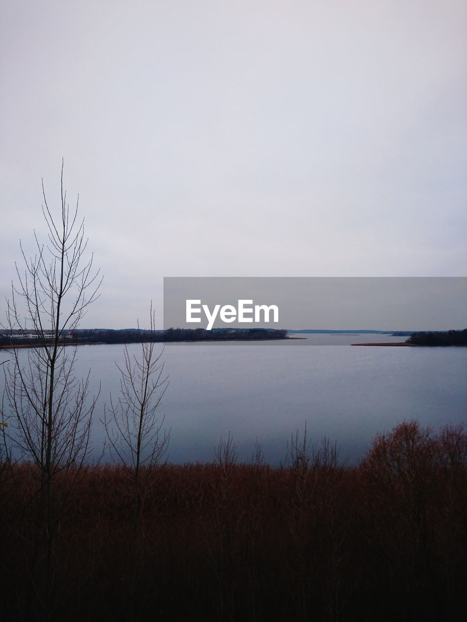 SCENIC VIEW OF LAKE AGAINST CLEAR SKY