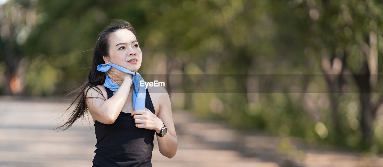 Portrait of woman standing outdoors