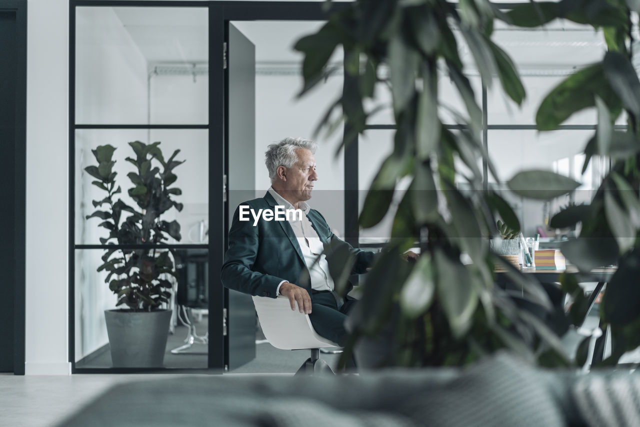 Businessman sitting on chair at office