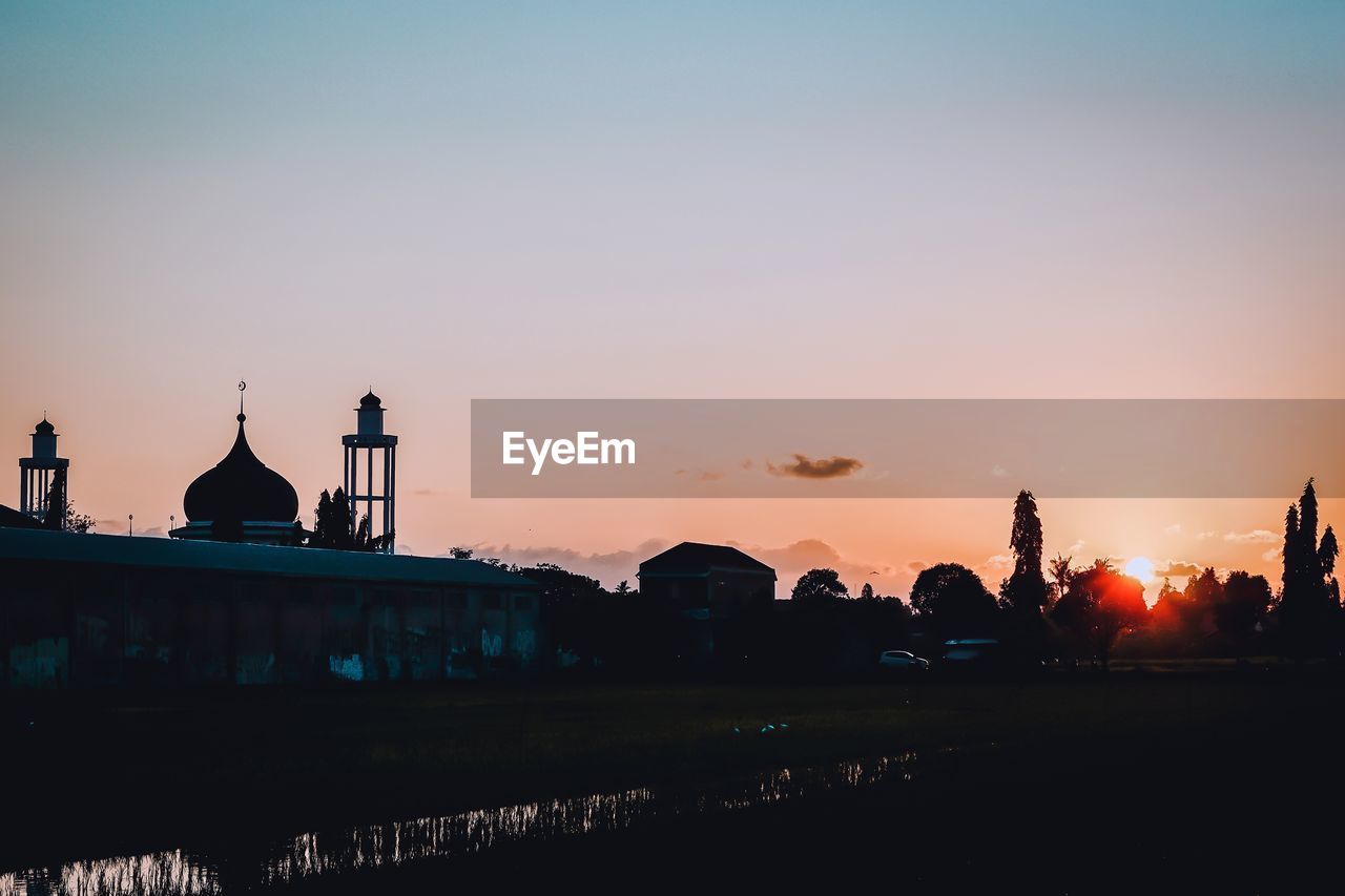 Mosque against sky during sunset