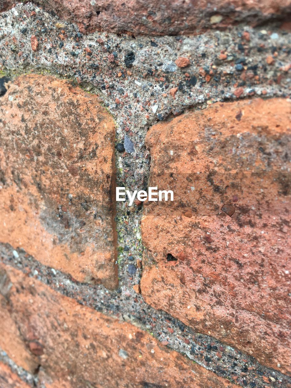 CLOSE-UP LOW SECTION OF SAND ON STONE