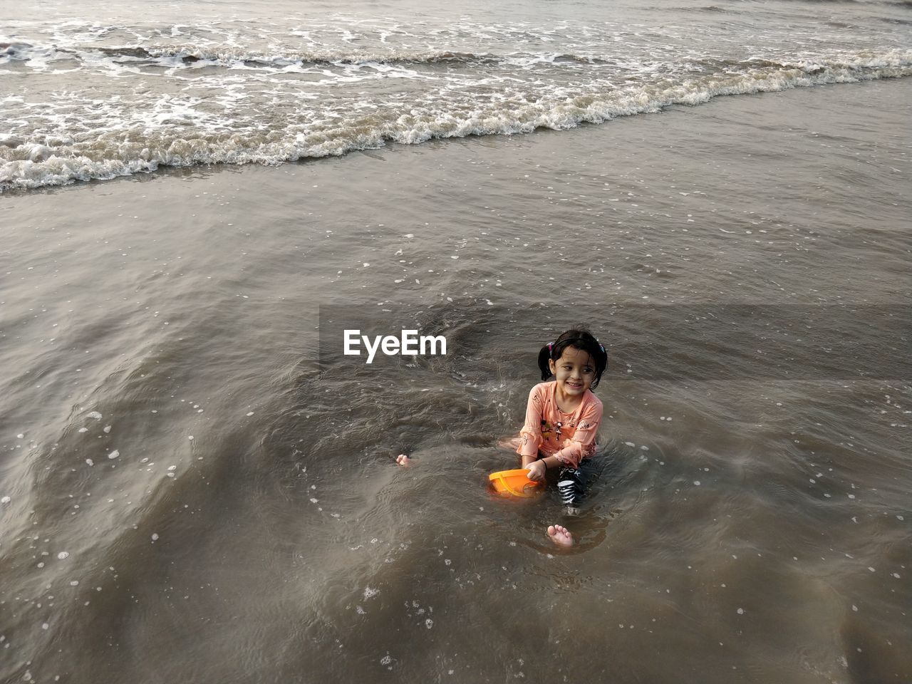 HIGH ANGLE VIEW OF BOY ON SEA