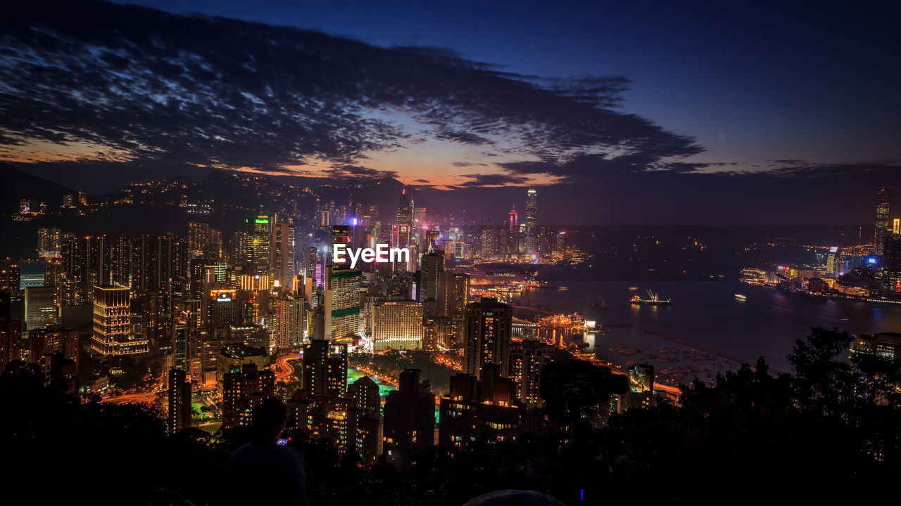 High angle view of illuminated city buildings at night