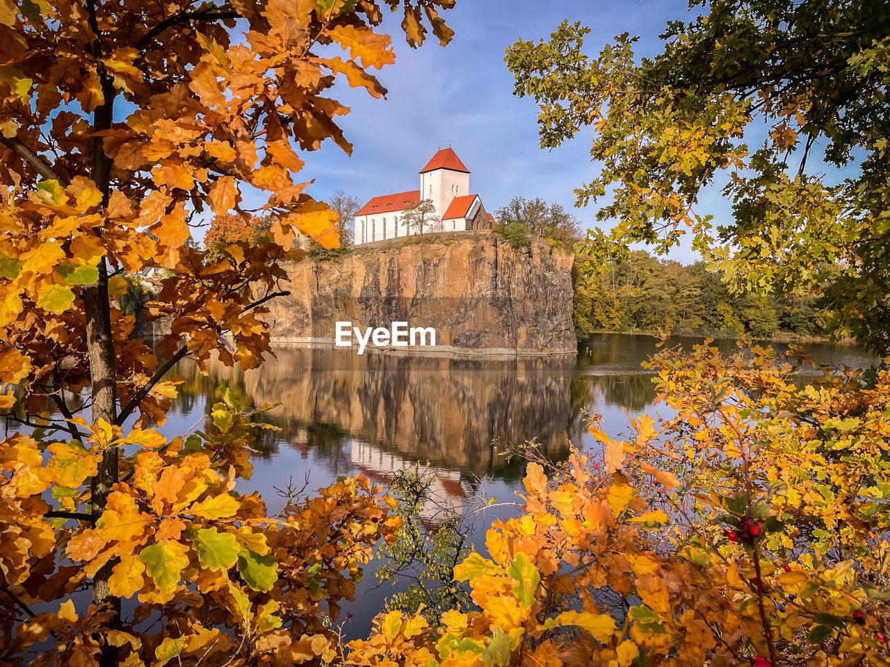 autumn, leaf, tree, plant, architecture, water, built structure, nature, travel destinations, reflection, building exterior, flower, lake, history, plant part, no people, tourism, travel, the past, park, beauty in nature, city, building, sky, day, château, outdoors, religion, maple, garden, maple leaf, yellow, place of worship, scenics - nature