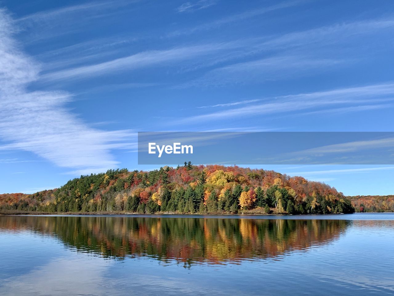 Scenic view of lake against sky during autumn