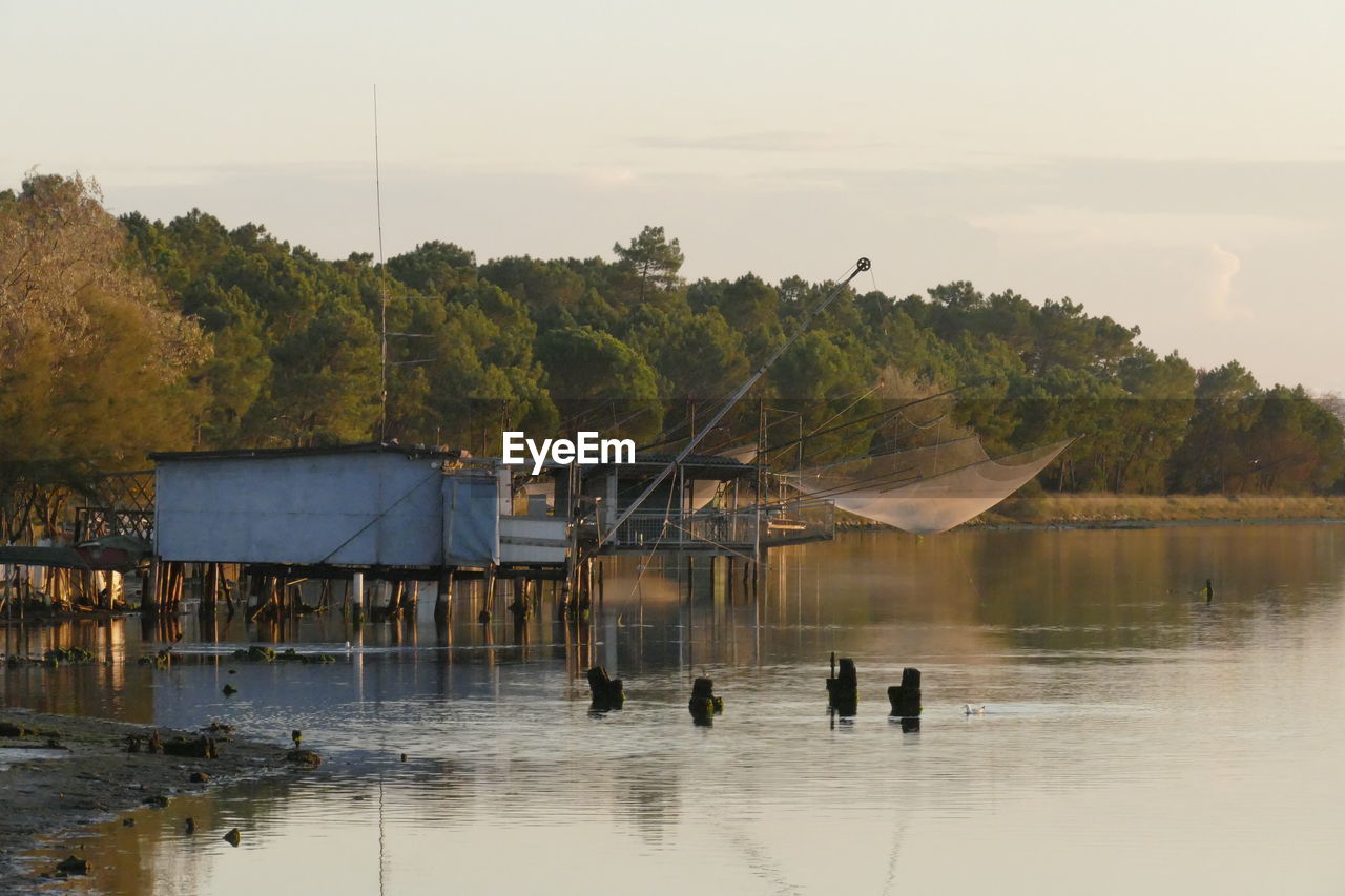 SCENIC VIEW OF LAKE AND BUILDINGS