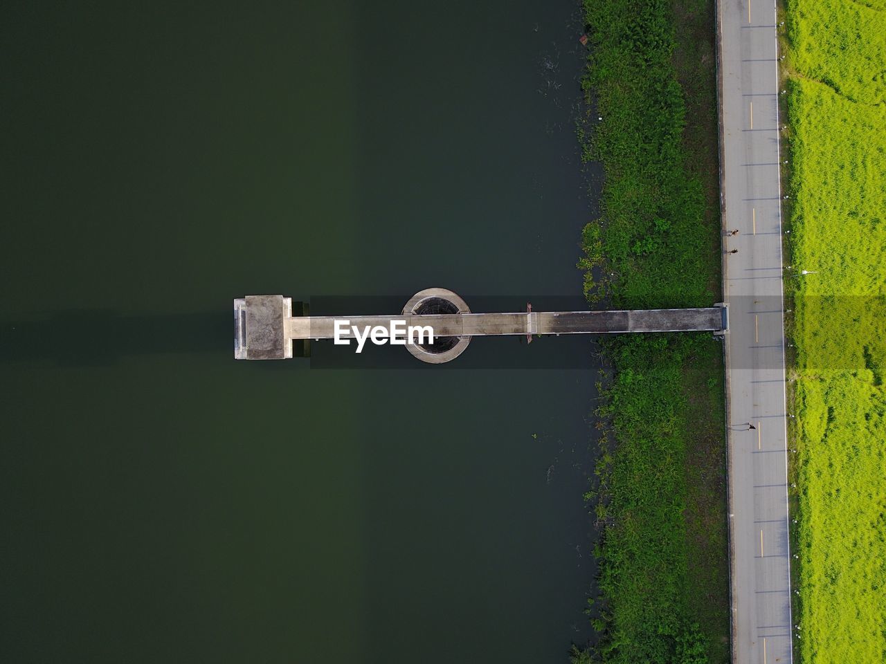 Aerial view of pier in lake by road 