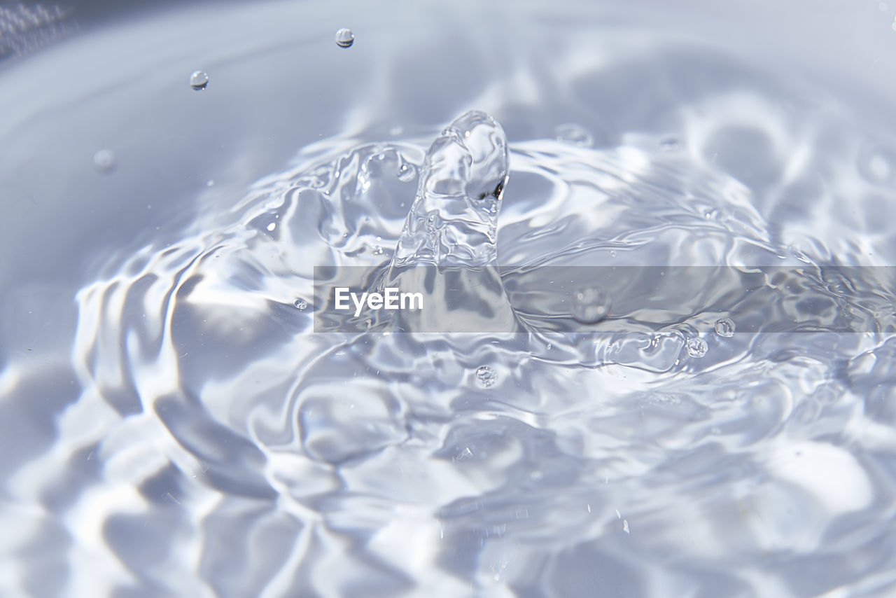 water, petal, rippled, no people, nature, backgrounds, drop, close-up, motion, freshness, splashing, freezing, full frame, food and drink, macro photography, blue, purity, indoors, refreshment, reflection, pattern, selective focus