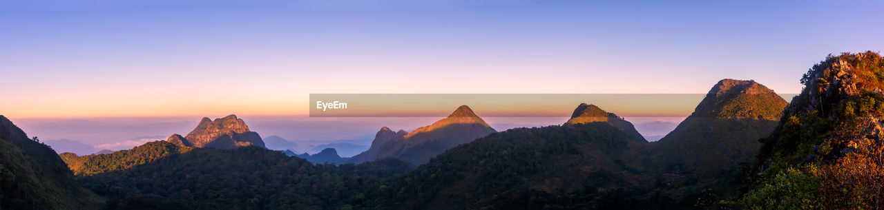 PANORAMIC VIEW OF MOUNTAINS DURING SUNSET